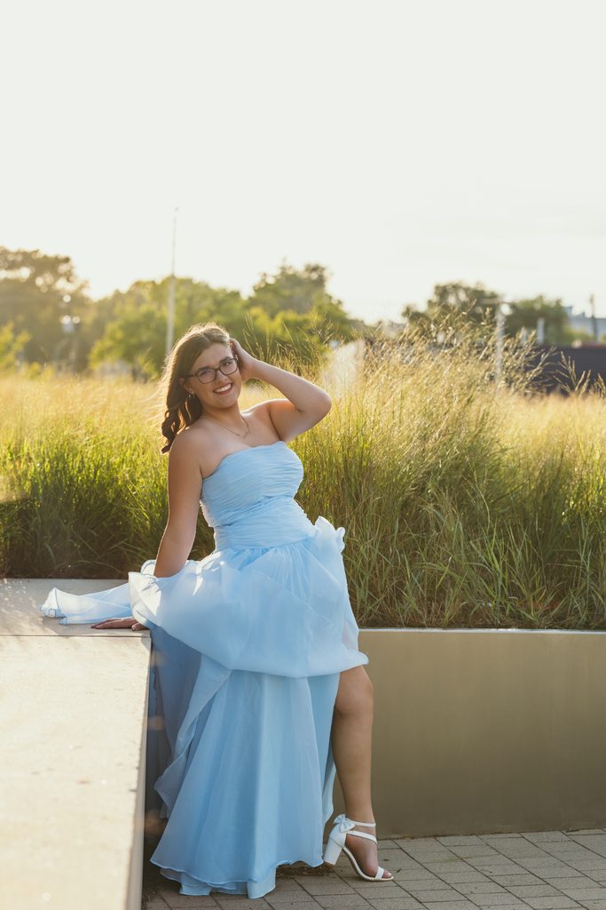 Kansas City senior portraits in a blue dress at the Kauffman Center for the Performing Arts