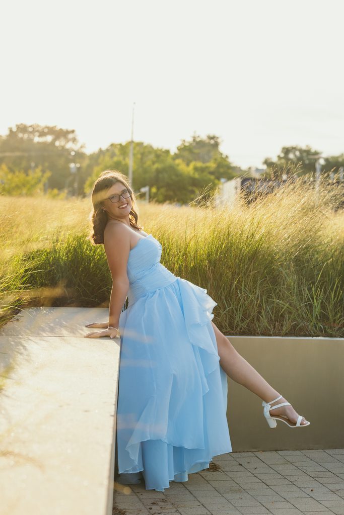 Kansas City senior portraits in a blue dress at the Kauffman Center for the Performing Arts