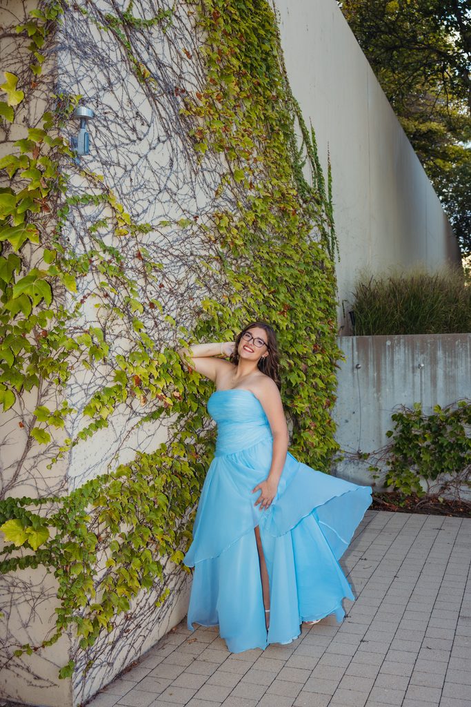 Kansas City senior portraits in a blue dress at the Kauffman Center for the Performing Arts