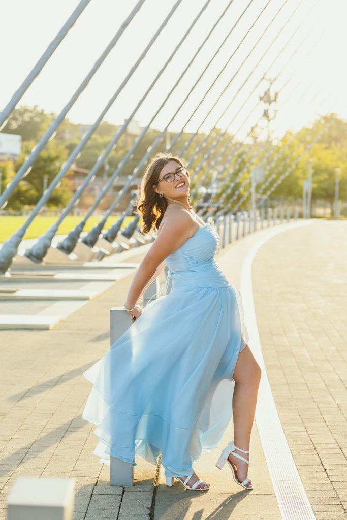 Kansas City senior portraits in a blue dress at the Kauffman Center for the Performing Arts