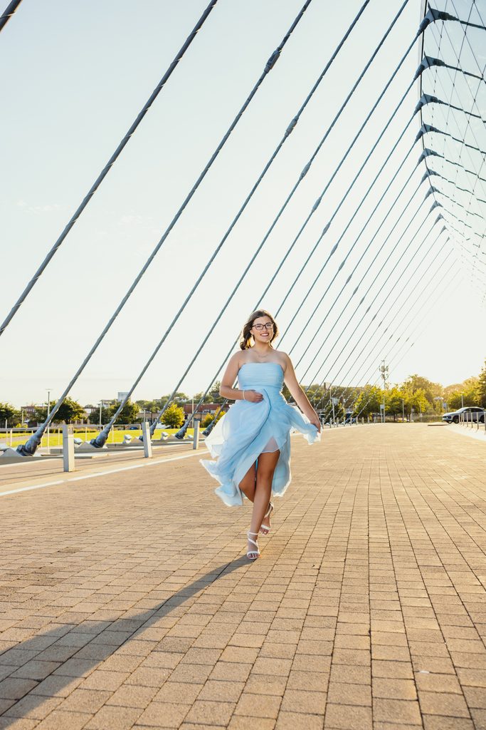 Kansas City senior portraits in a blue dress at the Kauffman Center for the Performing Arts