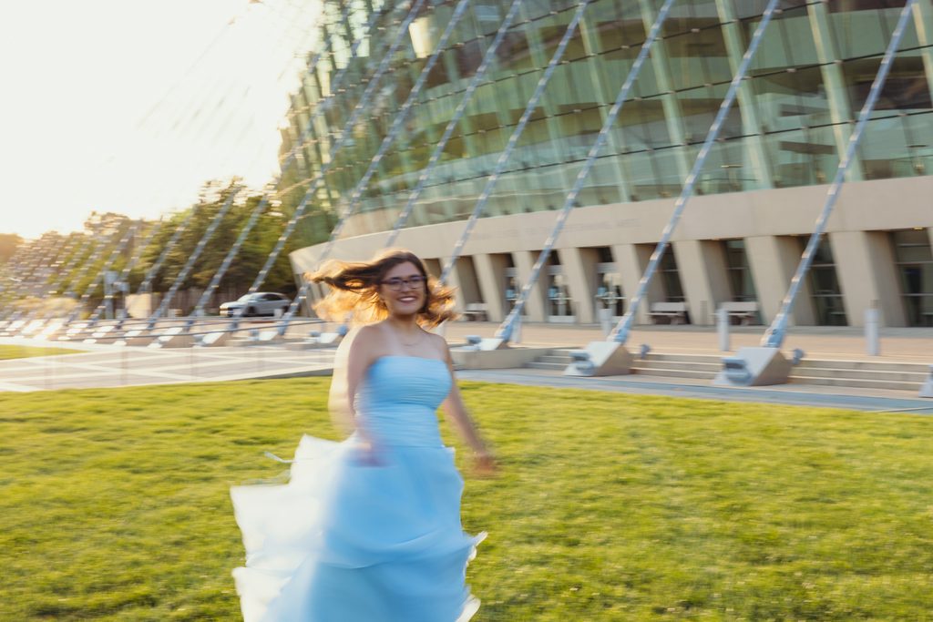 Kansas City senior portraits in a blue dress at the Kauffman Center for the Performing Arts