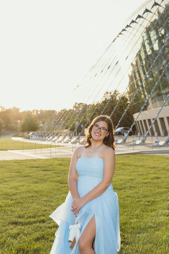 Kansas City senior portraits in a blue dress at the Kauffman Center for the Performing Arts