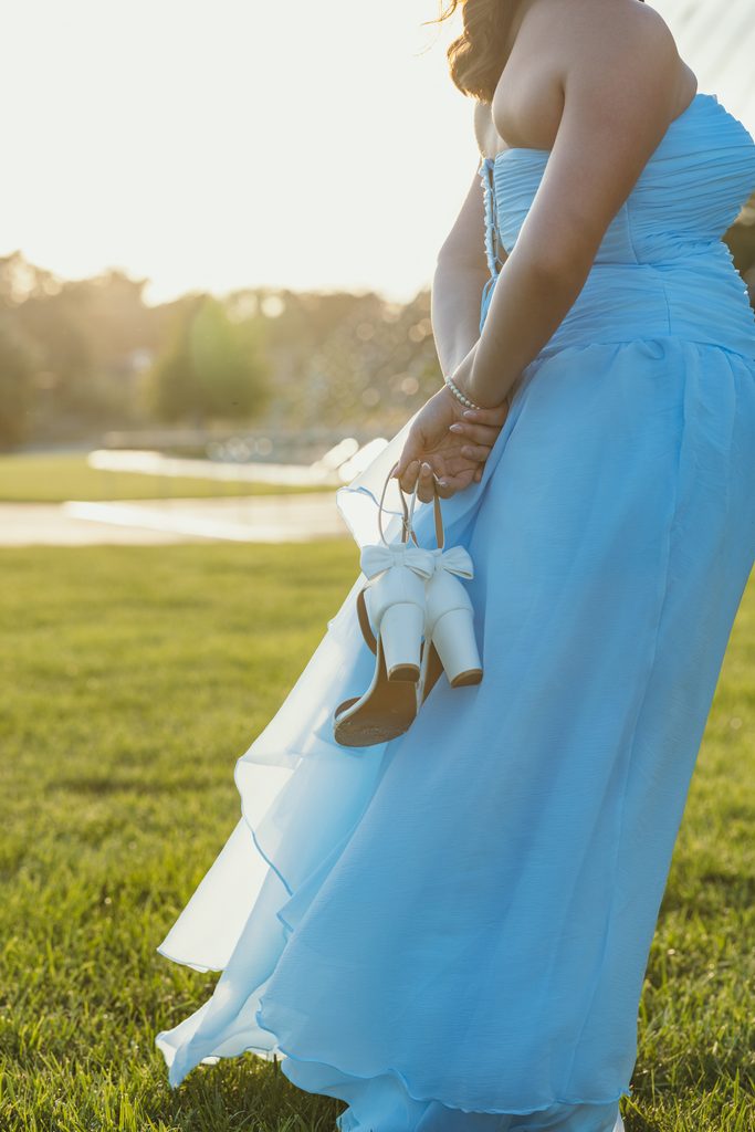 Kansas City senior portraits in a blue dress at the Kauffman Center for the Performing Arts